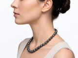Dark Tahitian circle baroque pearl necklace shown on a model